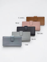 All Above Boutique collection of leather wallets in camel, pink, black, grey, and blue, featuring multiple card slots and a secure flap closure.