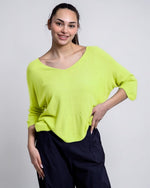 All Above Boutique bright lime green V-neck relaxed fit sweater with a textured bob de orez knit and dropped shoulders.