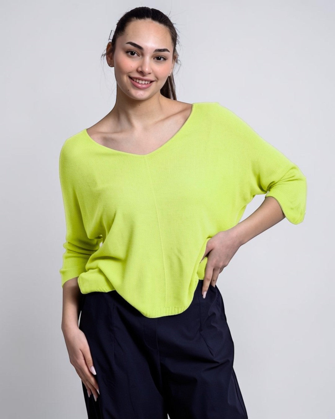 All Above Boutique bright lime green V-neck relaxed fit sweater with a textured bob de orez knit and dropped shoulders.