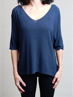 All Above Boutique navy blue relaxed fit V-neck sweater with a subtle rice grain texture and dropped shoulders.