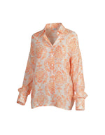 All Above Boutique loose-fit rayon shirt with orange and pink floral print, collared neckline, and button cuffs.