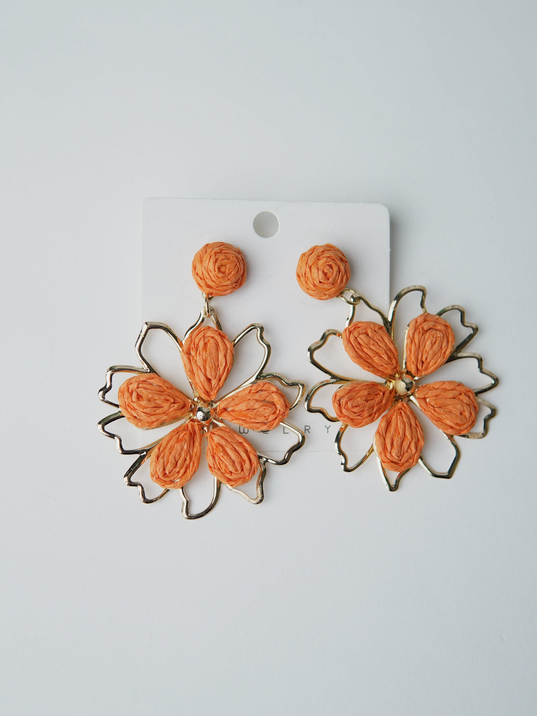 All Above Boutique orange straw flower earrings with gold frame, boho chic statement jewelry