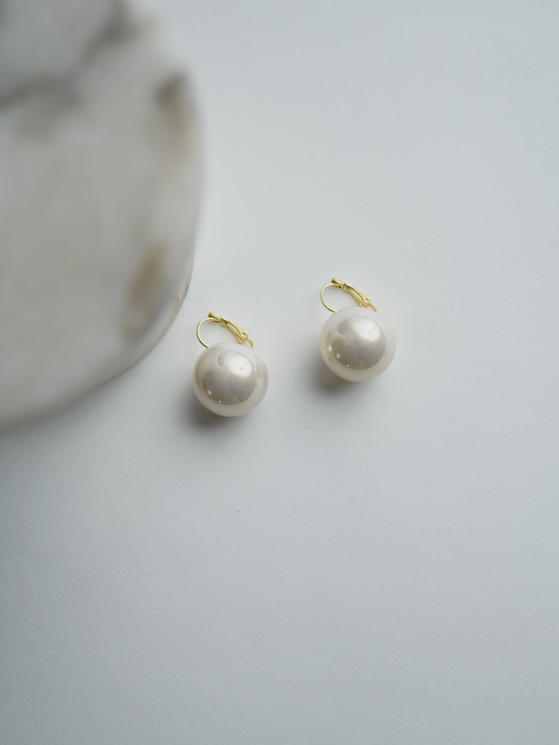 All Above Boutique statement pearl earrings with stainless steel closure. Creamy white, lustrous synthetic pearls.