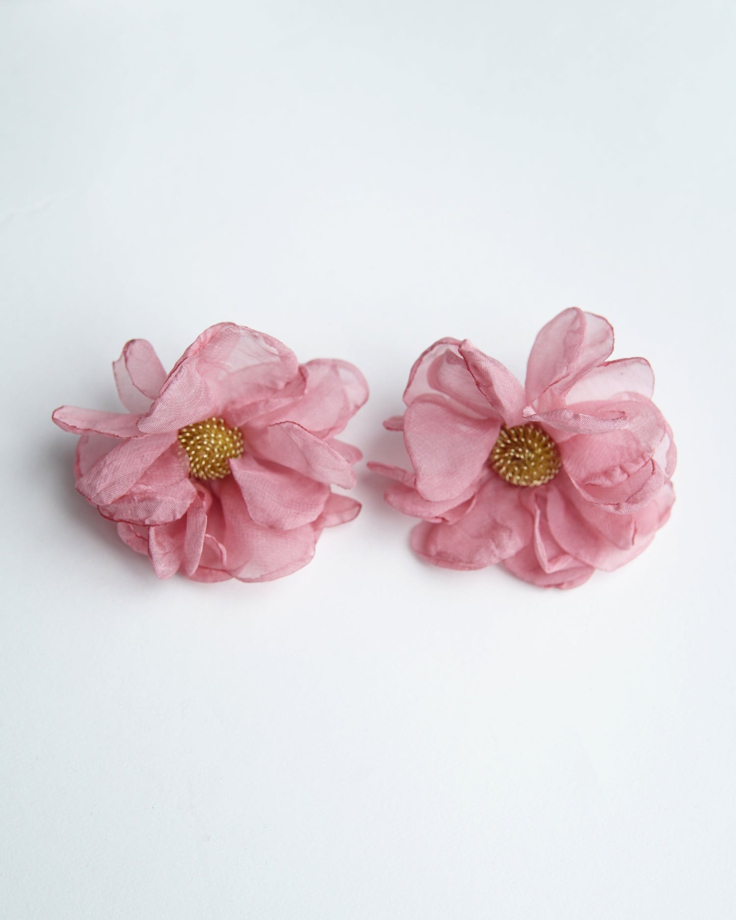 All Above Boutique pink floral fabric earrings with gold beaded centers, delicate and romantic design.