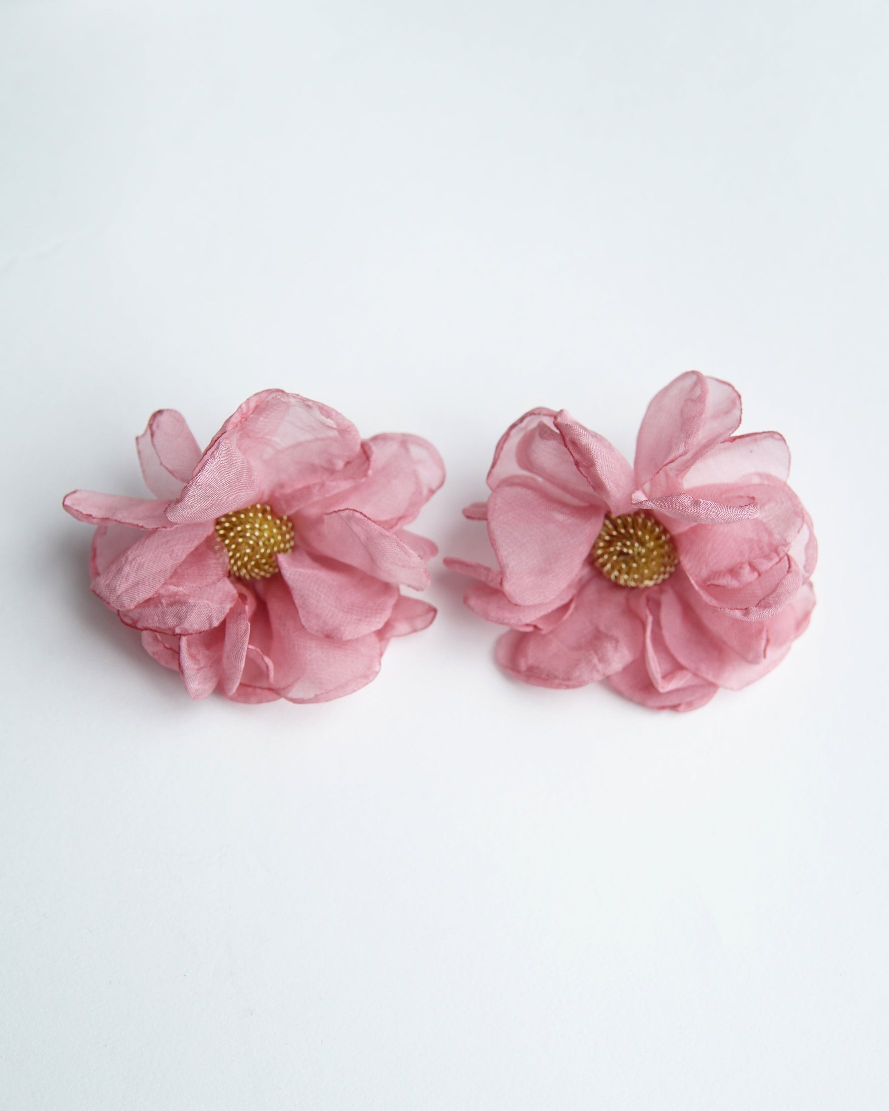 All Above Boutique pink floral fabric earrings with gold beaded centers, delicate and romantic design.