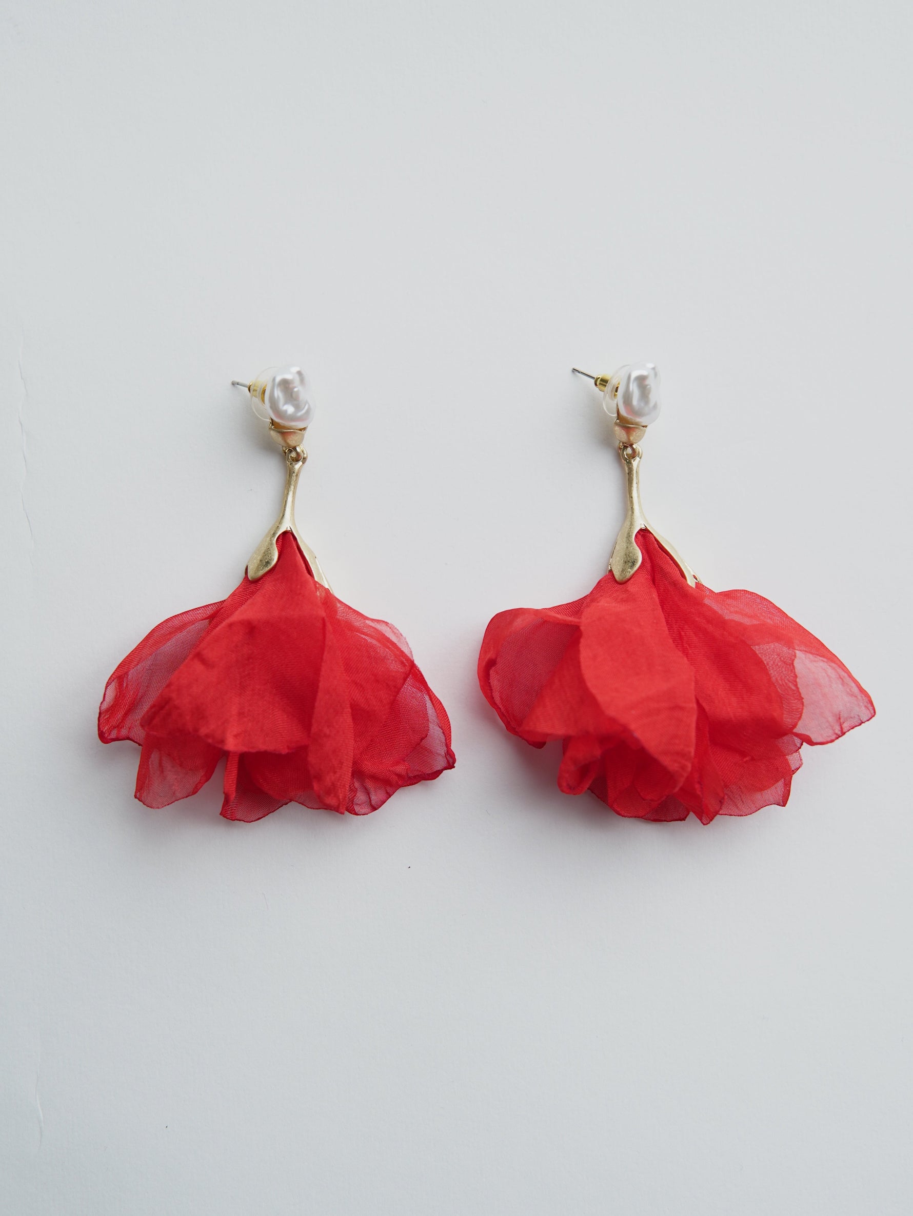 All Above Boutique red fabric flower dangle earrings with pearl accent. Stainless steel.