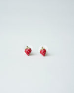 All Above Boutique small red strawberry stud earrings with gold accents and clear backing, perfect for a playful, feminine look.