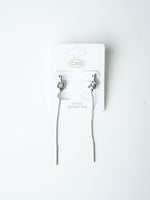 All Above Boutique silver knot drop earrings with long chain and bar end, minimalist design.