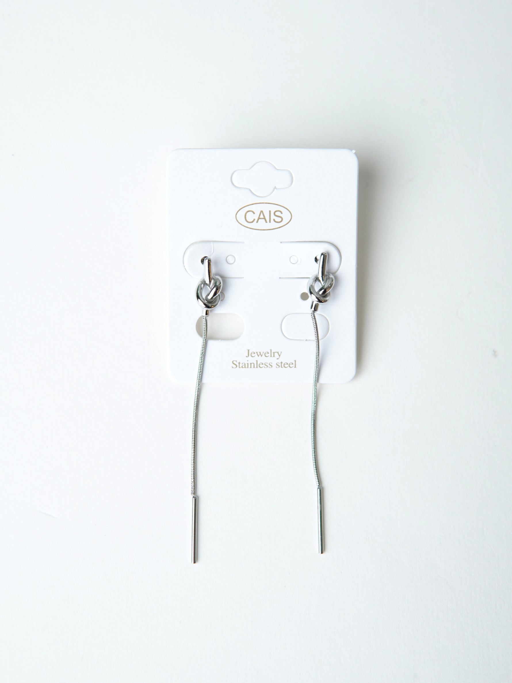 All Above Boutique silver knot drop earrings with long chain and bar end, minimalist design.