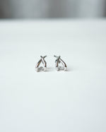 All Above Boutique silver organic asymmetrical stud earrings with a polished finish.