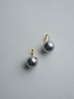 All Above Boutique silver pearl drop earrings with stainless steel clasps. Classic statement jewelry.