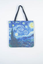 All Above Boutique blue canvas tote bag with Van Gogh's Starry Night print, dual straps, and zipper closure.