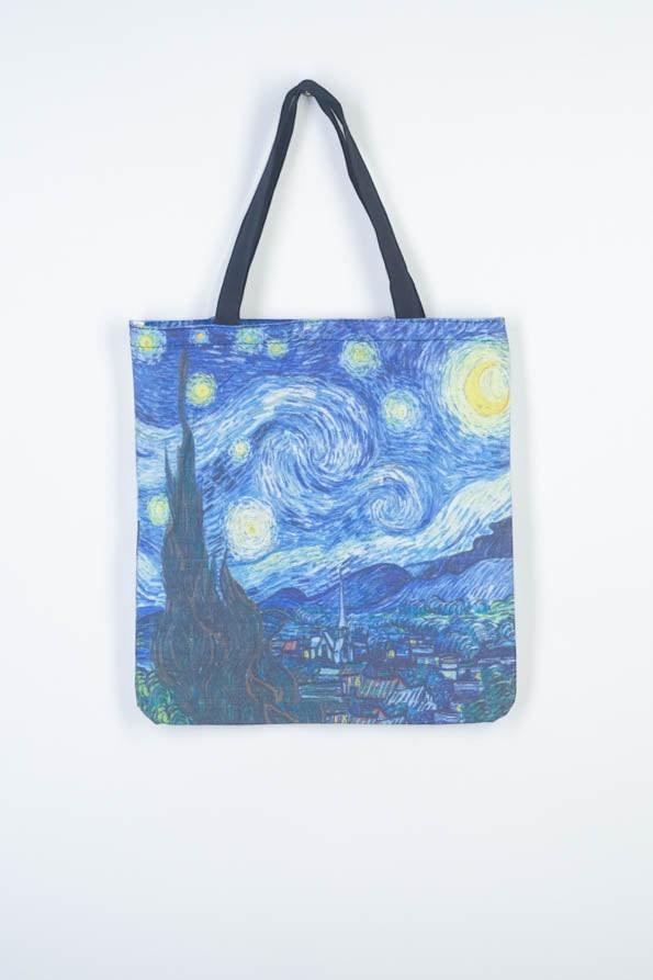 All Above Boutique blue canvas tote bag with Van Gogh's Starry Night print, dual straps, and zipper closure.