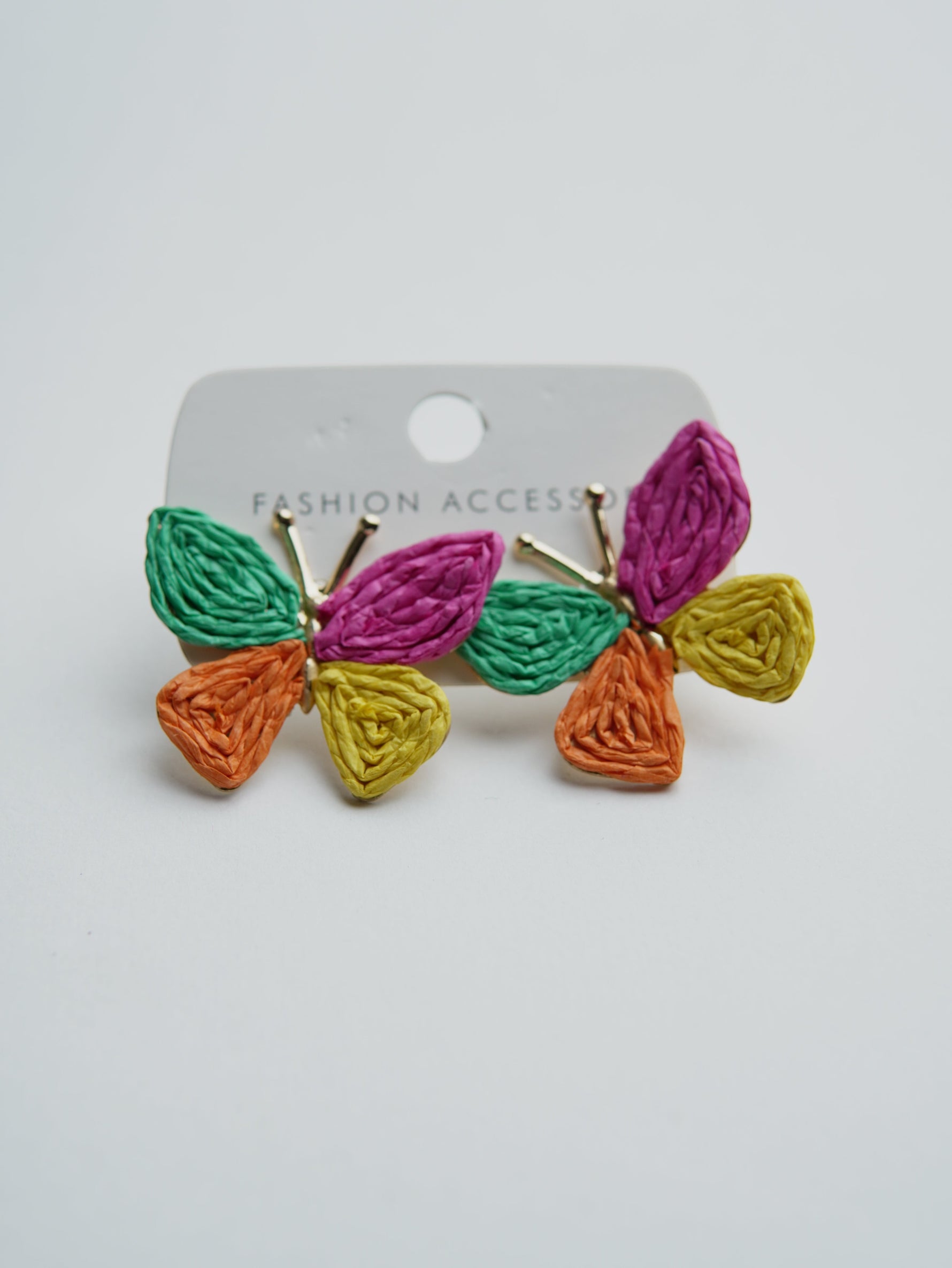 All Above Boutique colorful woven straw butterfly earrings in green, pink, yellow, and orange. Boho style.