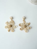 All Above Boutique natural straw flower dangle earrings with gold textured studs.