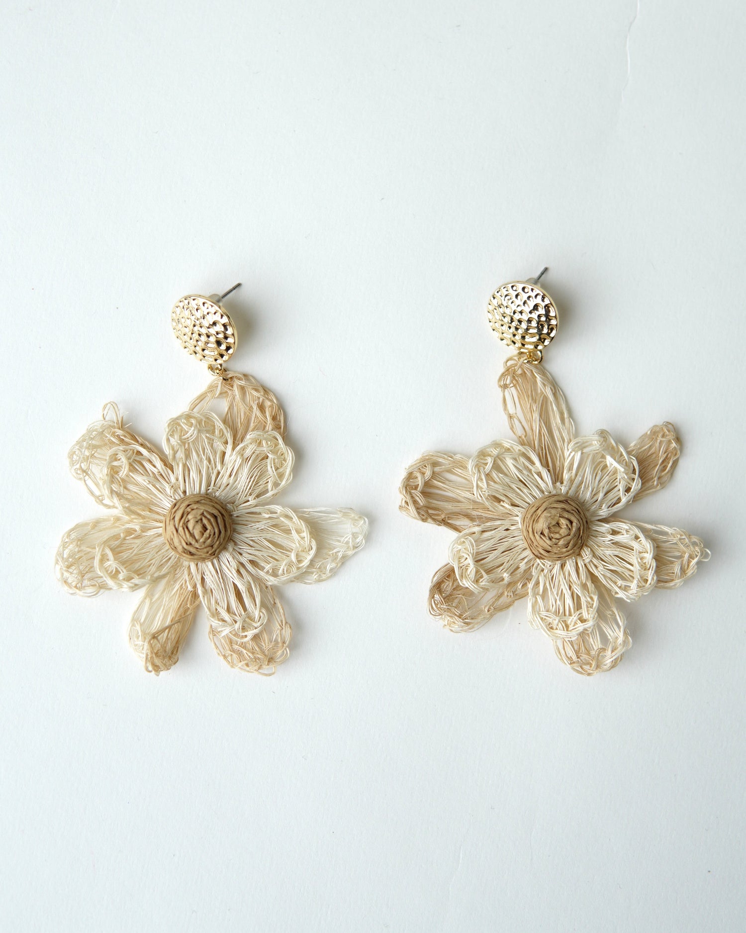 All Above Boutique natural straw flower dangle earrings with gold stud.