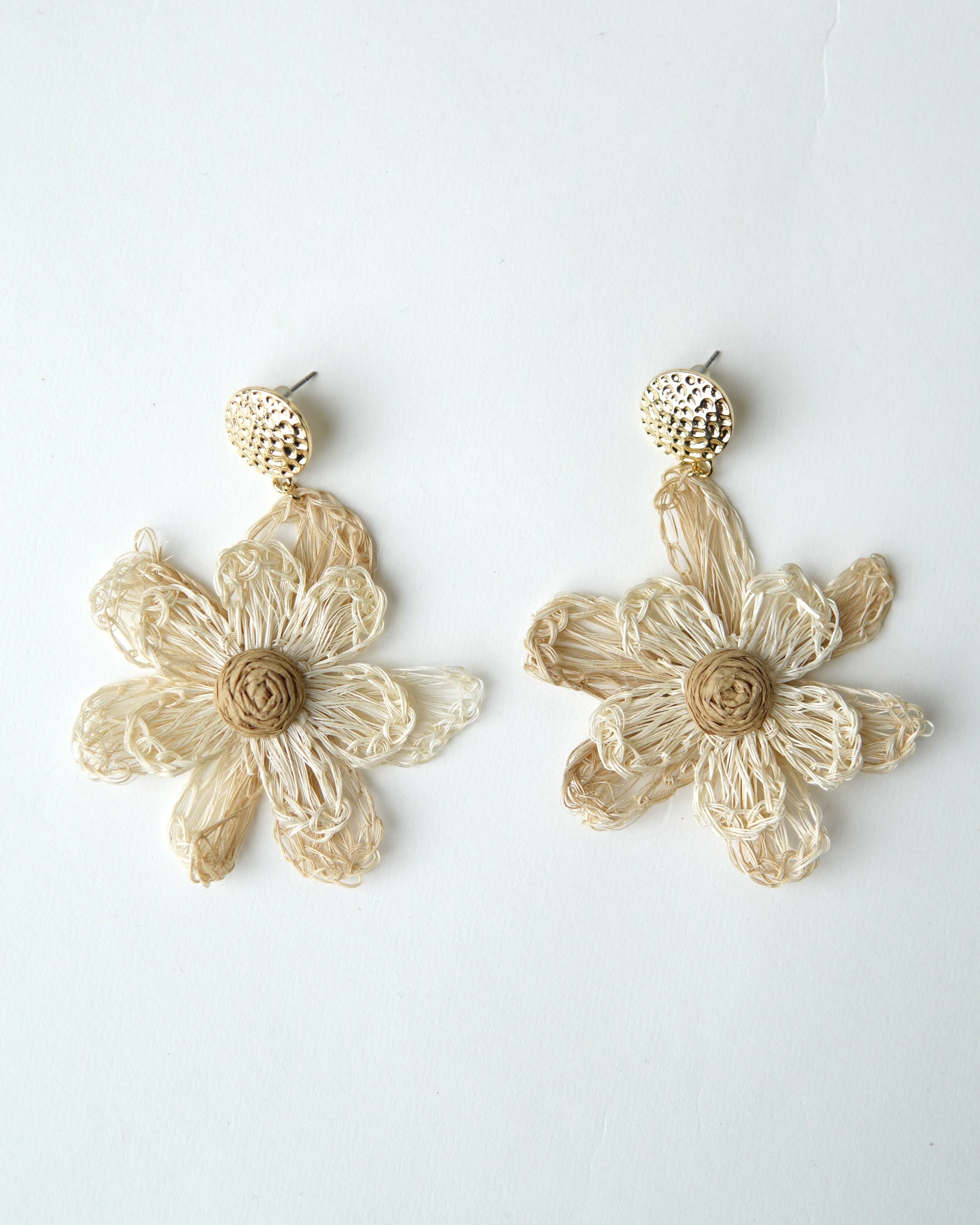 All Above Boutique natural straw flower dangle earrings with gold stud.