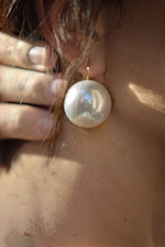 All Above Boutique large white pearl statement earrings with stainless steel closure, elegant and versatile.