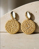 All Above Boutique natural woven wood round statement earrings with hammered gold tops.