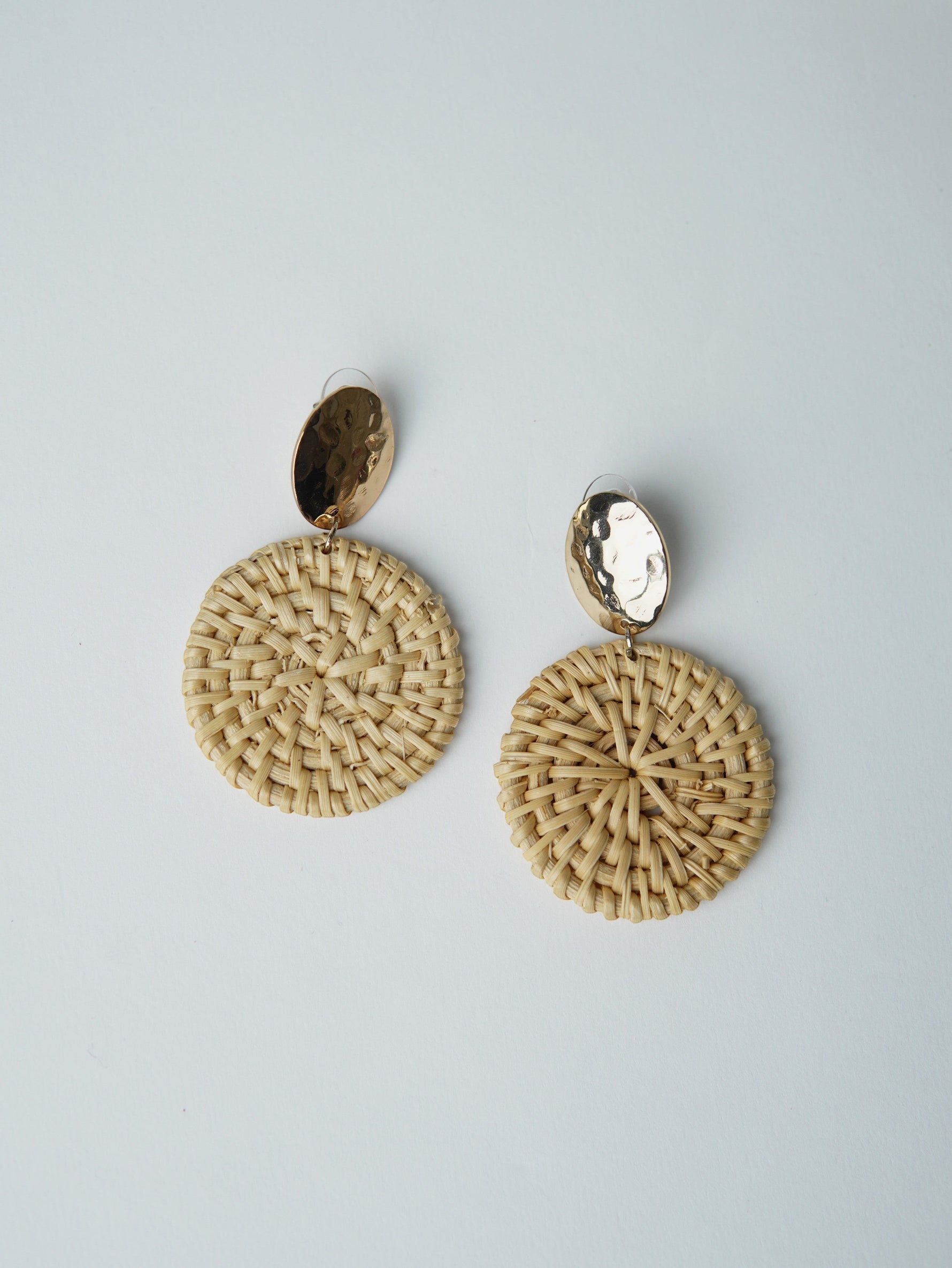 All Above Boutique natural woven wood round drop earrings with hammered gold-tone tops. Boho chic style.