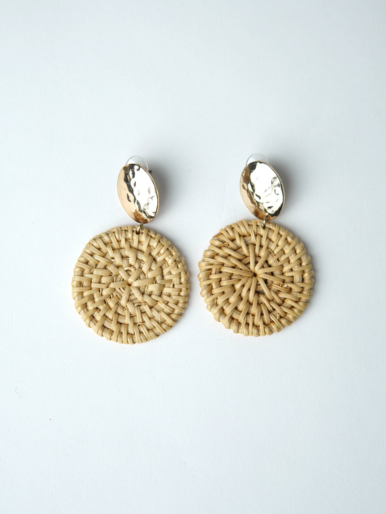 All Above Boutique natural woven wood round statement earrings with hammered gold tops.