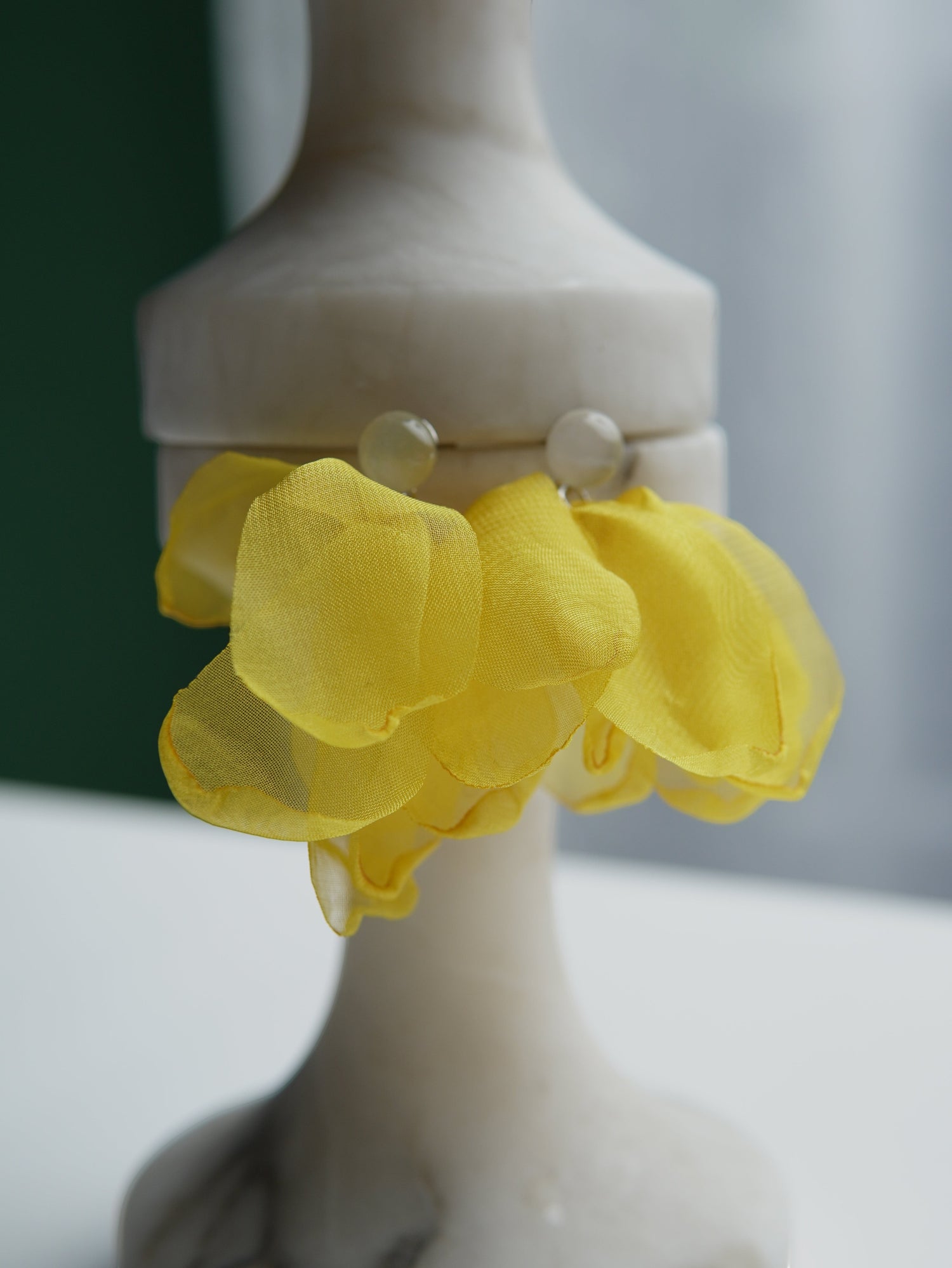All Above Boutique yellow wavy silk statement earrings with translucent stud