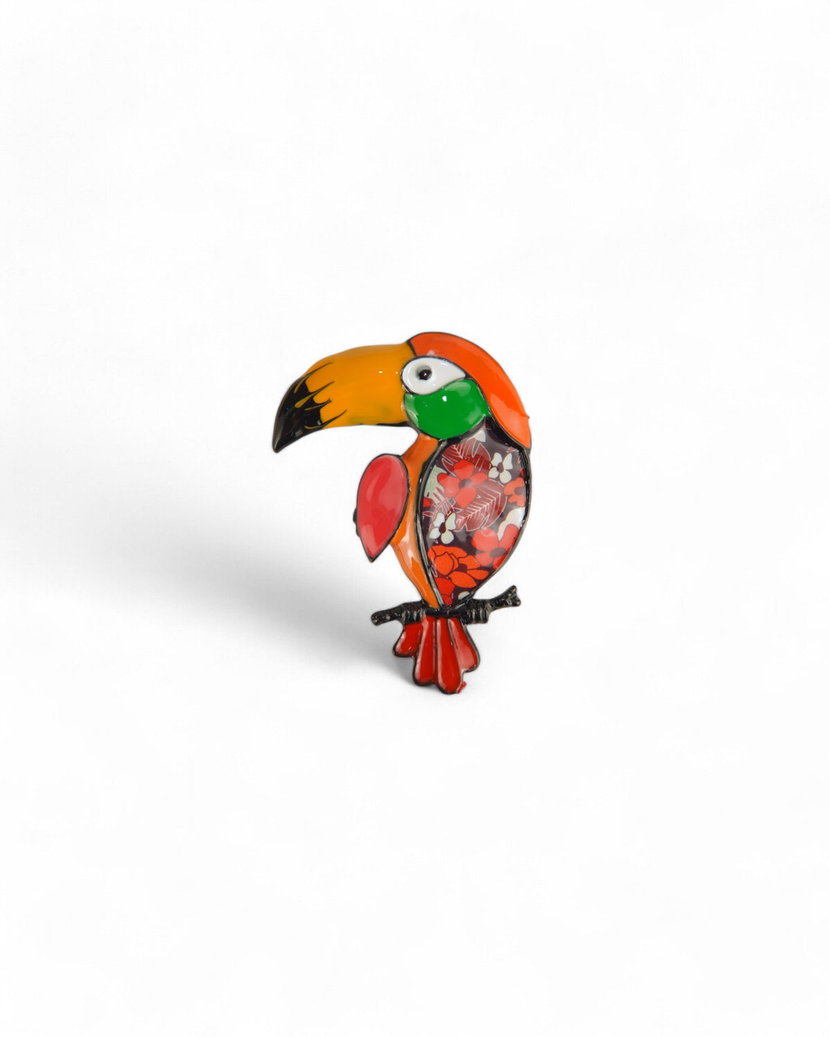 Broșă portocalie tucano, cu accente vibrante și detalii florale.